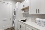 Fabulous Laundry room with full sides washer and dryer.